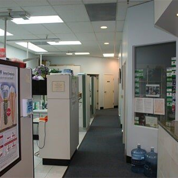 Dental office hallway with posters