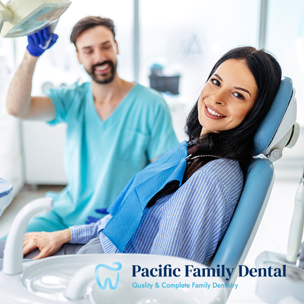Dentist with smiling patient chair