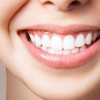 Smiling person showing white teeth