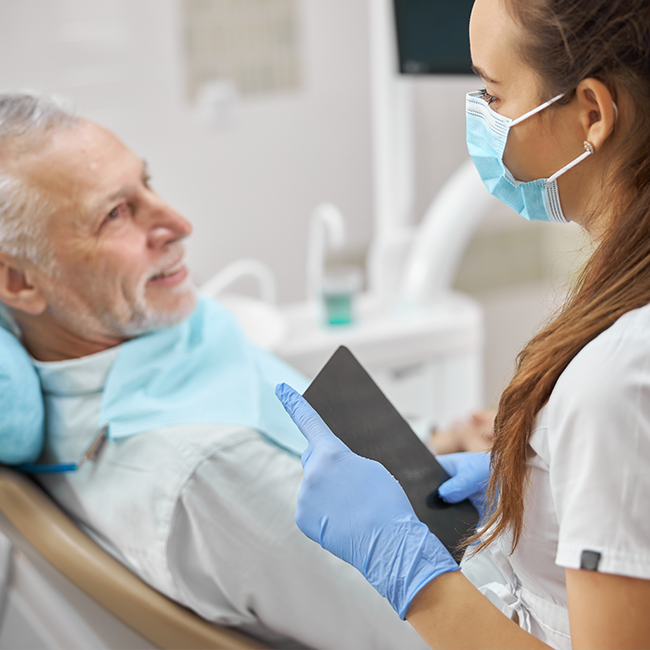 Dentist consulting with patient chair