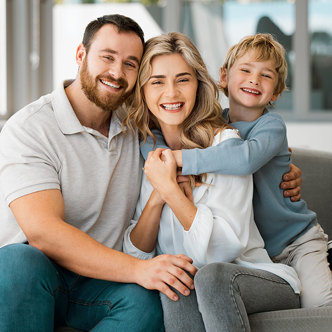 Smiling family sitting together happily